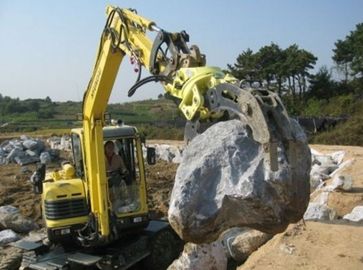 Ο εκσκαφέας τοποθέτησε υδραυλικό μηχανικό επιτίθεται για την αρπαγή